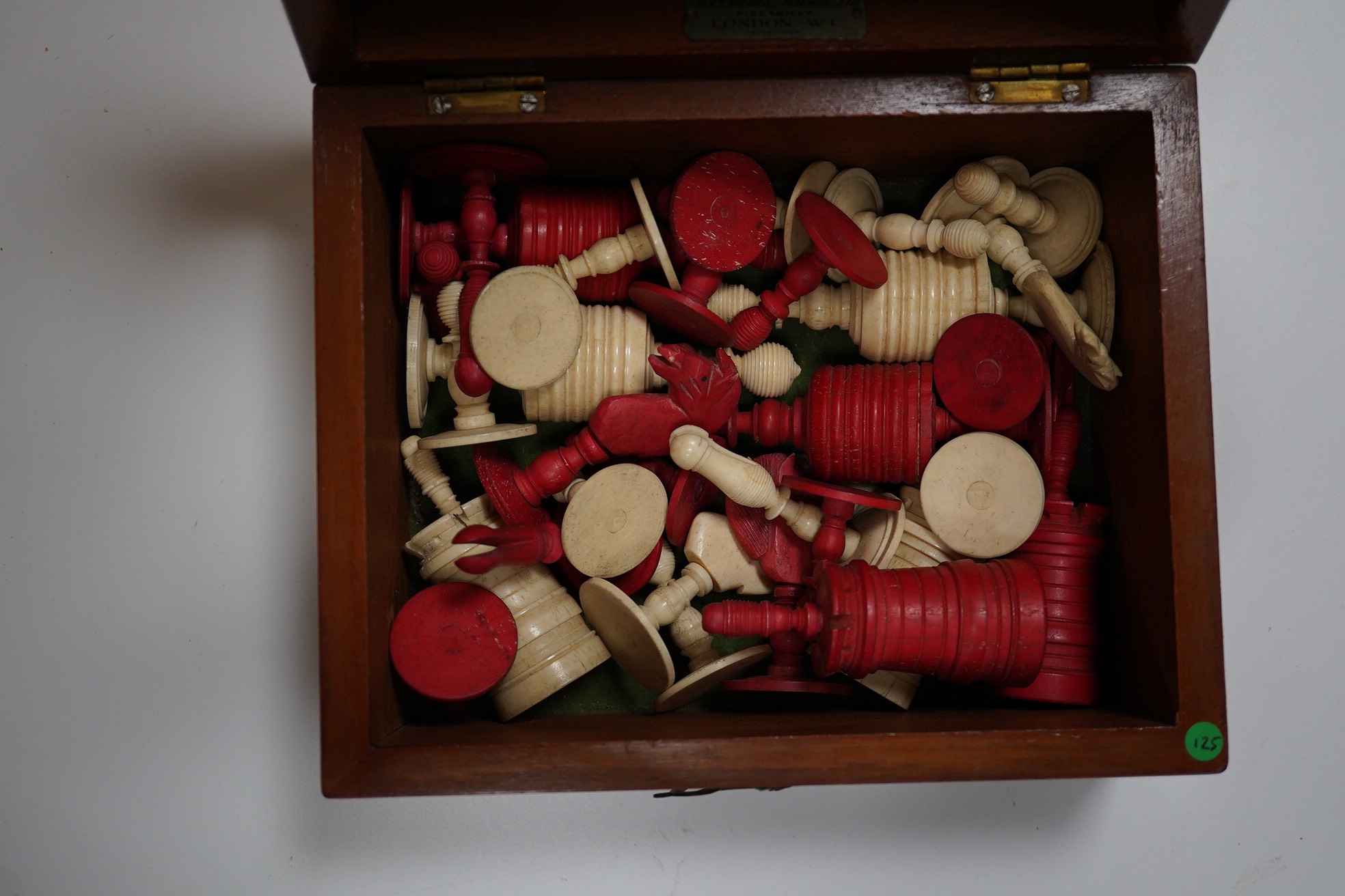 A 19th century boxed Indian stained and turned bone chess set, box 19cm wide, 10cm high. Condition - good